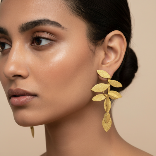 Parna gold-plated brass leaf earrings with contemporary sculptural design